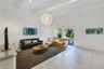 Vaulted ceilings with exposed structural beams, tile flooring, and a large spherical pendant light fixture