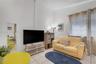 High ceilings with neutral wall finish and ceramic tile flooring