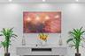 Wall-mounted display screen above a minimalist, light gray media console featuring integrated storage cabinetry and recessed ceiling lighting