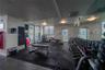 Fitness center featuring tile flooring, ceiling-mounted lighting, and floor-to-ceiling windows with access to an exterior terrace