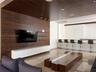 Floor-to-ceiling windows, polished stone flooring, and multiple glass-paned doors featuring metal frames
