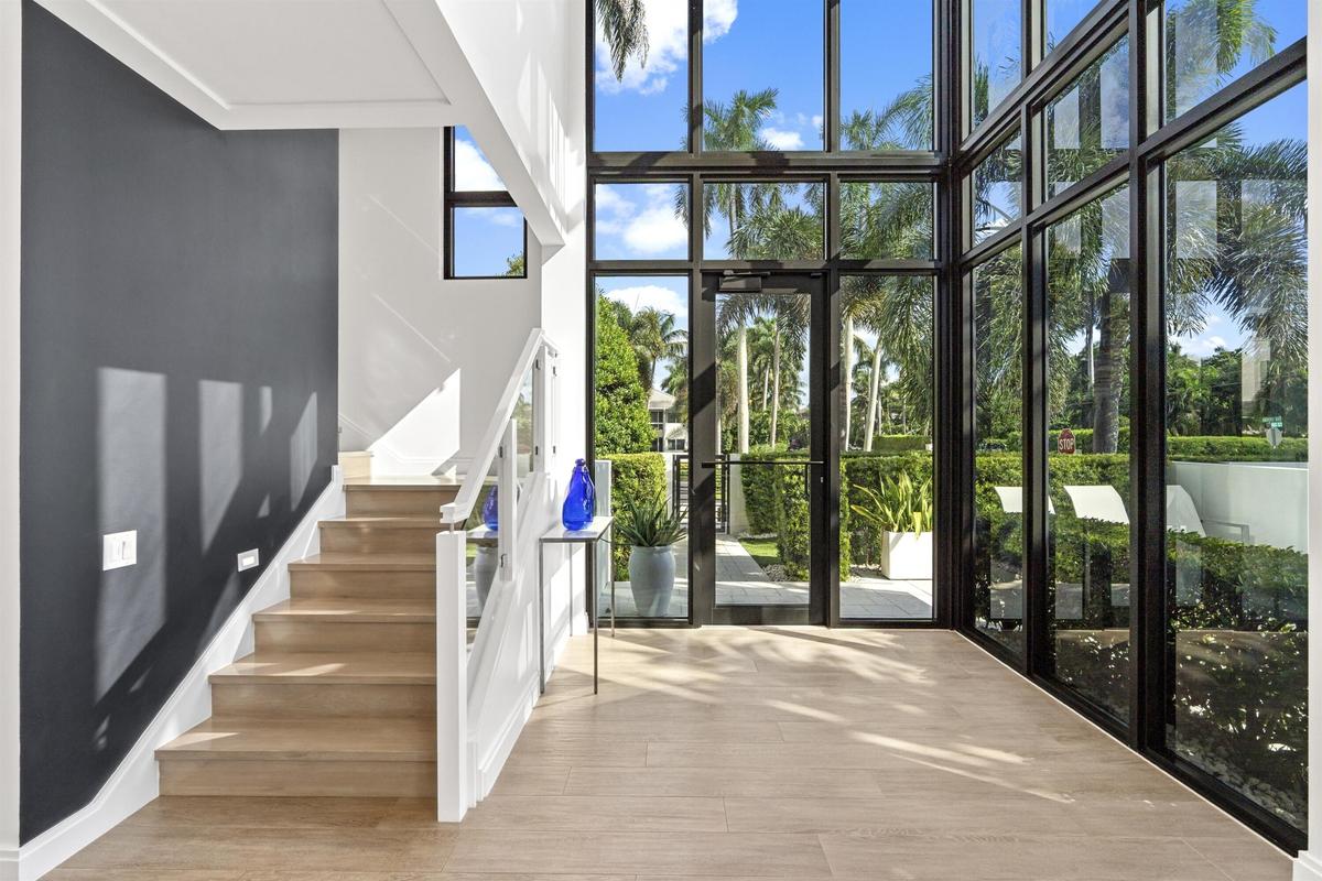 Porcelain tile wood plank flooring and elevator serves all 4 floors