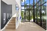 Porcelain tile wood plank flooring and elevator serves all 4 floors