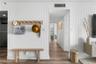 Vertical shiplap wall paneling paired with wood-finish flooring throughout