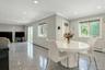 Eat-in kitchen opens to family room with door to deck plus sliders
