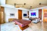Polished stone flooring, textured wall treatments, wood-finish paneling, and ceiling-mounted industrial-style hardware