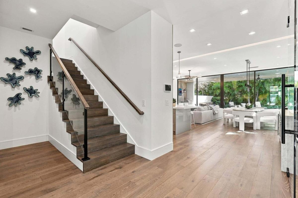 Custom Stained Staircase Featuring Glass Stair Railings