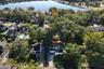 aerial view of home and lake