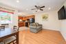 Kitchen featuring wood cabinetry, recessed lighting, and a ceiling fan, complemented by wood-finish flooring
