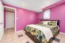 Room featuring tile flooring with decorative inlay, recessed ceiling lighting, a window with exterior exposure, and a built-in wall cabinet with paint
