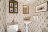 Powder room located off of front entry