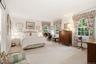 Ensuite primary bedroom with dressing room and full bath