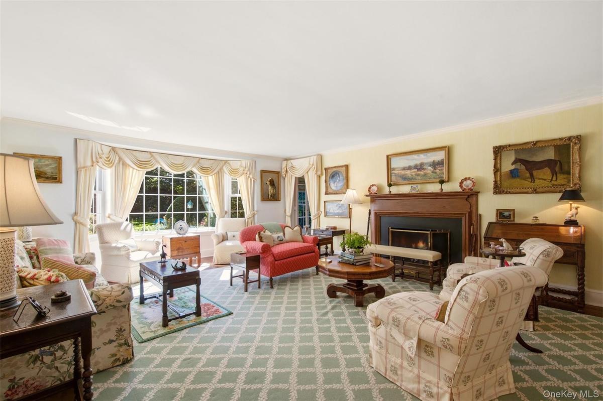 Formal living room with wood burning fireplace