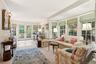 French doors in Den open to bluestone terrace.