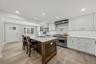 Close-up or secondary angle of the kitchen finishes, showcasing storage and counter space.