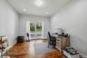 Room featuring wood-finish flooring, recessed lighting, and glass sliding doors to the patio