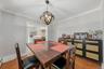 Dedicated dining space positioned conveniently near the living area, ideal for family meals or entertaining.