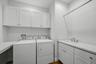 Convenient to bedrooms. Cabinets to store cleaning supplies, detergent, etc.