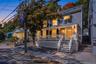 Stunning twilight exterior view of the front porch colonial, highlighting the warm lighting and inviting curb appeal.