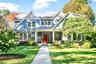 Beautifully maintained 2013-built Center Hall Colonial clad in stone and hardiplank with welcoming covered porch and professionally landscaped grounds