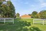 Main Barn – Side View with Grass Riding Arena