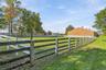 Rear View of Both Barns & Outdoor Grass Arena