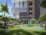 Outdoor recreational area featuring a structured play system with a slide, climbing dome, and rope swing, set within a landscaped space defined by a w