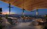 Covered rooftop terrace featuring a wood-finished ceiling, built-in outdoor kitchen with stone countertop, recessed lighting, and ceiling fans