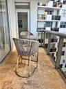 Private balcony featuring natural stone flooring and a railing with glass panel inserts