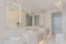 Double vanity featuring integrated rectangular sinks, stone countertops, full-width mirror with vertical LED lighting, recessed ceiling lighting, and 
