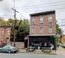 FRONT VIEW OF LOT AT 195 SOUTH STREET BEHIND WOODEN FENCE AND 197 SOUTH STREET / BLACC VANILLA COFFEE SHOP.