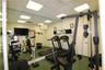 Full-wall mirror, recessed lighting, drop ceiling, and white panel doors