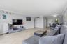 Neutral-toned interior featuring large-format diagonal tile flooring, crown molding, and recessed lighting