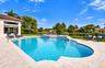 Sparkling new pool with sunshelf and umbrella for extra shade