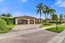 3 car garage with epoxy floors, and full built in cabinetry