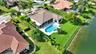 Acreage pool home with lakefront views