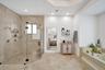 Updated separate shower with full glass enclosure and dual shower heads