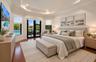 Primary bedroom with plenty of room for your peleton bike plus 2 walk-in custom closets