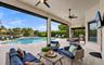 Covered patio with motarized screens for unobstructed views and no mosquitos...
