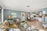 311 open plan living room, door leads to carport & laundry / utility room