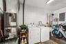 Shared laundry / utility room plus storage.