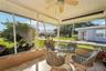 309 - Step outside your living room to the private screened lanai.