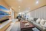 Accent wall featuring vertical wood slat detailing, floating wall-mounted media console, recessed ceiling lighting, and wall-to-wall drapery