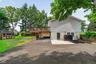More driveway space and entrance to lower level apartment area.