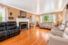 Living room with wood burning fireplace