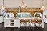 Custom kitchen. Prior sale staging; the home is offered unfurnished.