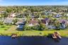Home identified by the arrow. Pools and docks shown are on neighboring properties.