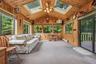 Sun room with tons of windows, skylights & vaulted ceiling