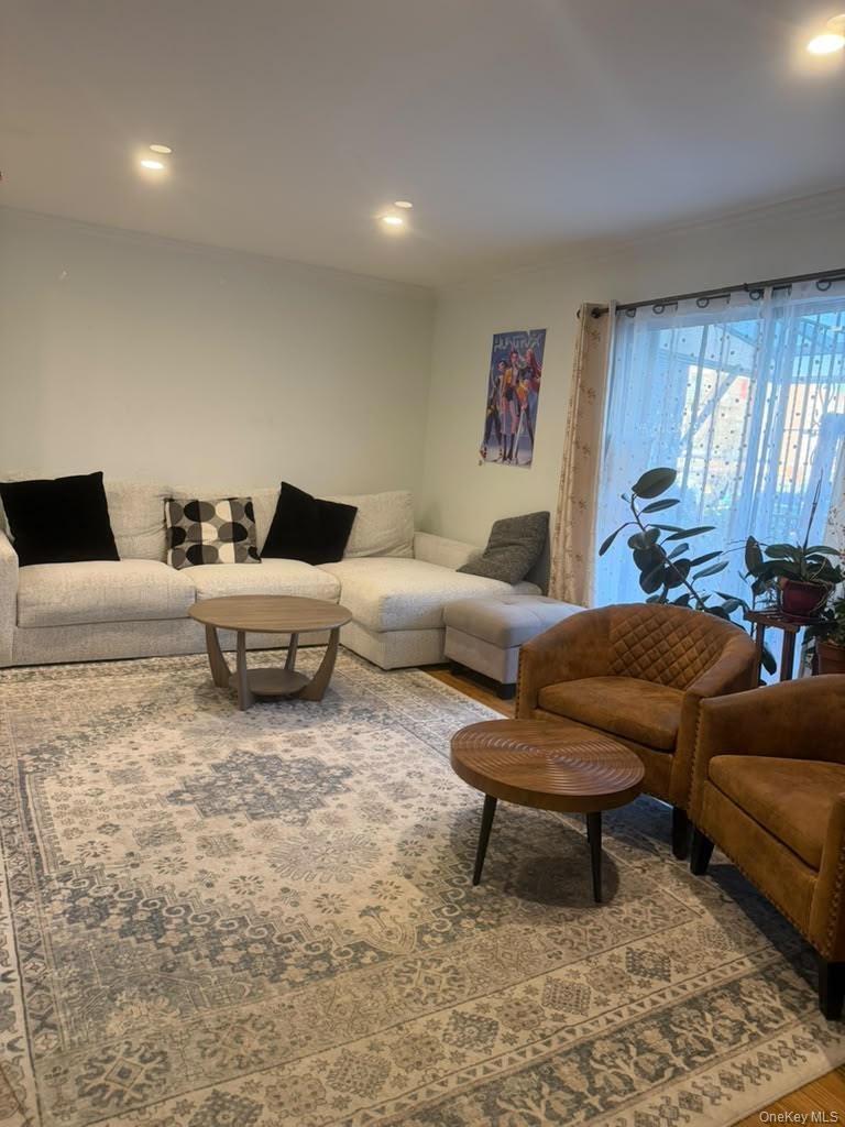 Living area featuring recessed lighting, sliding glass door, and hardwood flooring