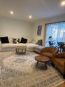 Living area featuring recessed lighting, sliding glass door, and hardwood flooring